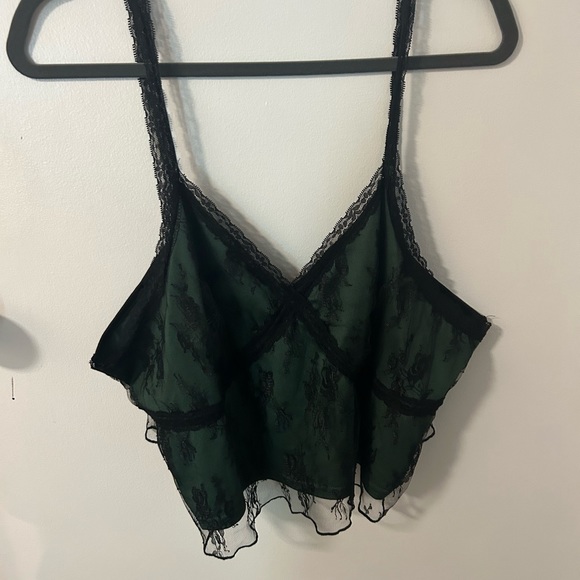 Plus size, 90s inspired, crop top. It is a dark green with a black lace overlay. - Picture 2 of 3